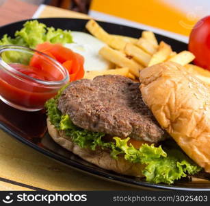 Burger And Chips Representing French Fries And Hamburger