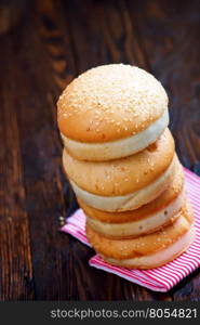 burger buns on the wooden table, fresh buns