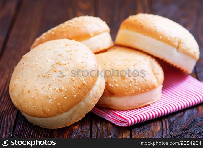 burger buns on the wooden table, fresh buns