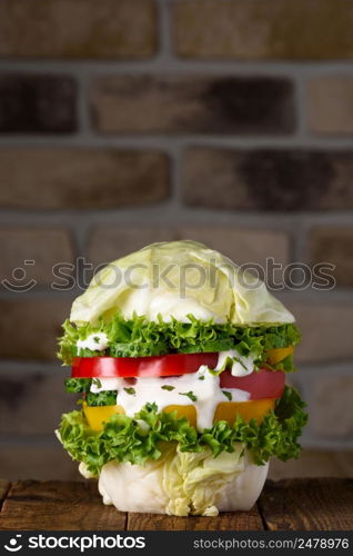 Burger fully vegan big pure organic vegetable hamburger concept on wooden table still life