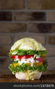 Burger fully vegan big pure organic vegetable hamburger concept on wooden table still life