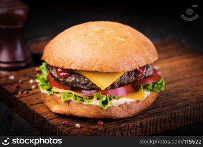 burger. homemade grilled burger on wooden board