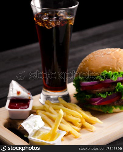 Burger served in bun in nutrition fast food concept. The burger served in bun in nutrition fast food concept