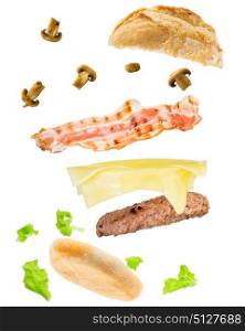 burger with cheese ham lettuce mushrooms floating against white background