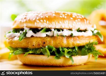 burger with chicken on wooden table