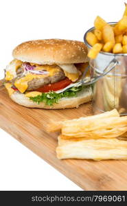 burger with fried potatos in bucket serving on wooden board