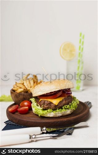 burger with fries wood plate