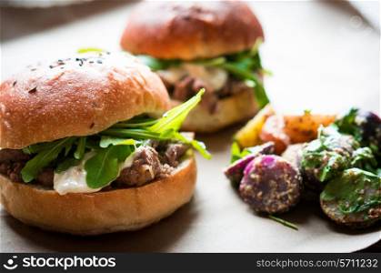 Burgers on wooden background
