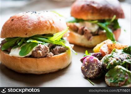 Burgers on wooden background