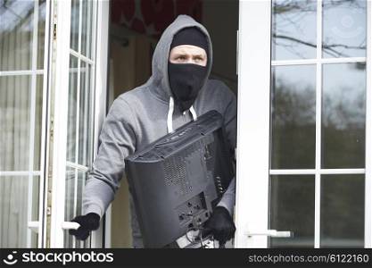 Burglar Breaking Into House And Stealing Television