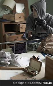 Burglar Stealing Items From Bedroom During House Break In