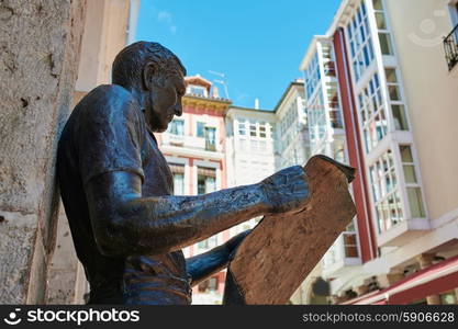 Burgos statue or the newspaper reader next to Plaza Mayor square in Castilla Spain