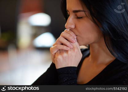 burial, people and mourning concept - close up of unhappy woman praying god at funeral. close up of unhappy woman praying god at funeral