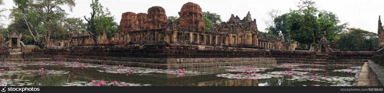 BURIRAM, THAILAND - CIRCA FEBRUARY 2017 Prasat Mueang Tam Stone Sanctuary and lotuses in pond