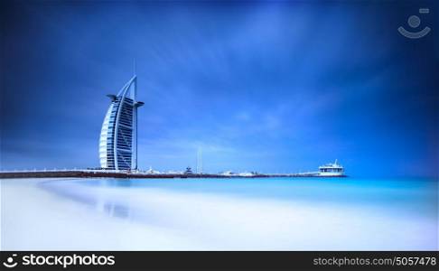 Burj Al Arab hotel on Jumeirah beach in Dubai, modern arabic architecture, luxury beach resort, summer vacation and tourism concept
