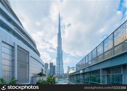 Burj Khalifa in Dubai Downtown skyline, United Arab Emirates or UAE. Financial district and business area in smart urban city. Skyscraper and high-rise buildings at noon with blue sky.