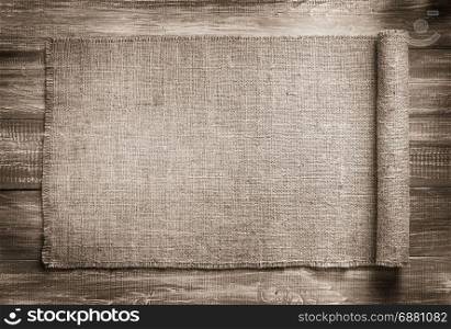burlap hessian sacking on wooden background