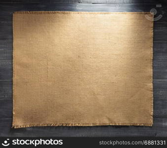 burlap hessian sacking on wooden background