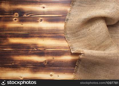 burlap hessian sacking texture on wooden background surface