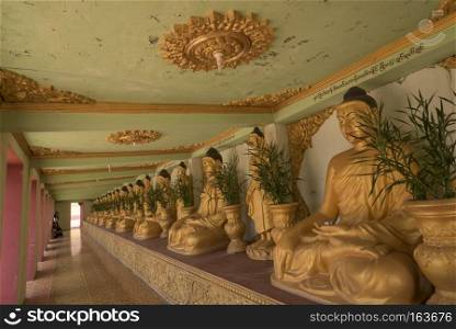 Burmese style temple Located in the Ye city of Burma.. Buddha in the building. Buddha in the building