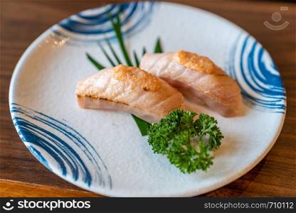 Burn Flaming Salmon Sushi in Traditional Japanese style plate