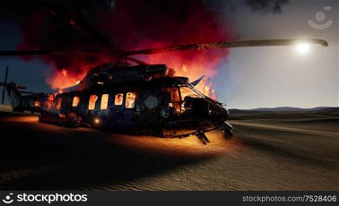 burned military helicopter in the desert at sunset