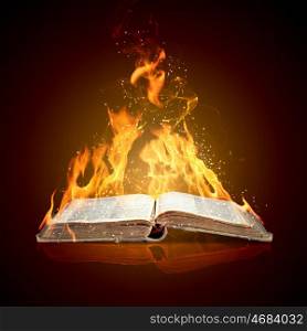 Burning book. Image of magic book in flames of fire