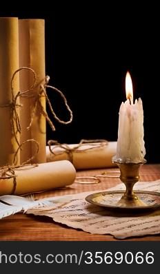 burning candle and antique items