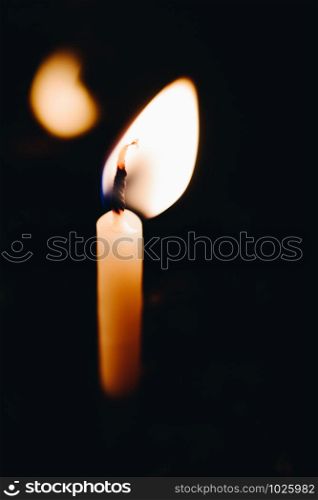 burning candle making light in view