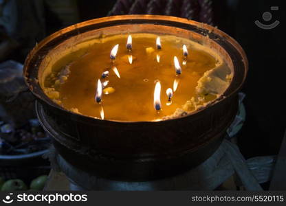 Burning candles in Ani Tsangkung Nunnery, Barkhor, Lhasa, Tibet, China