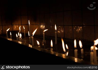 Burning candles with candle light in the dark