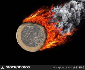 Burning coin with a trail of fire and smoke - 1 euro