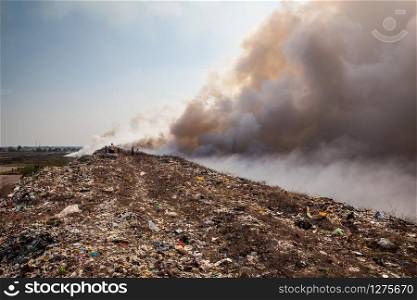 Burning garbage heap of smoke from a burning pile of garbage