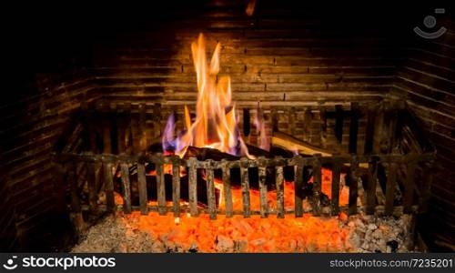 Burning logs in a Winter fireplace