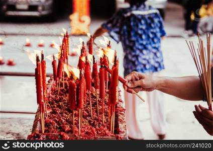Burning red chinese candle at Wat Mangkon Kamalawat famous Chinese temple in Bangkok, Wat Mangkon Kamalawat (Leng Noei Yi). close up shot