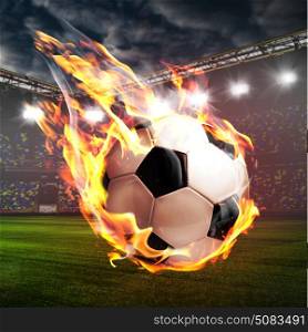 Burning soccer ball on stadium. Soccer or football ball on fire at stadium