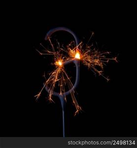 Burning sparkler in shape of number three, digit 3, isolated on black background.