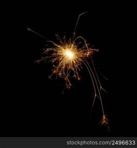 Burning sparkler star isolated on black. Spark design element.