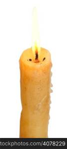 burning stearin candle close up isolated on white background