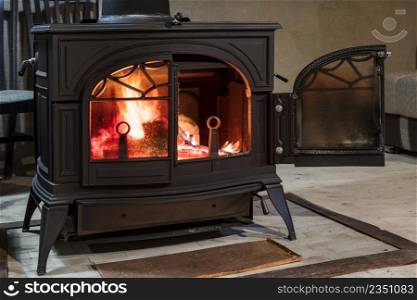 burning wood in the stove in a country house
