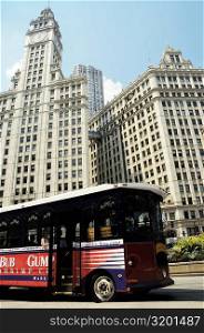 Bus parked in front of a building, Wrigley Building, Chicago, Illinois, USA