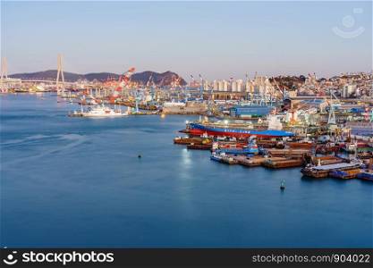 BUSAN, SOUTH KOREA - DECEMBER 29, 2018: Aerial view of Busan Harbor Bridge and the Port of Busan in South Korea. Container ship in import export and business logistic in Busan new port.