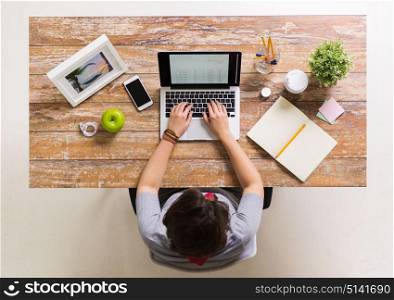 business, accounting and freelance concept - woman with receipt on laptop computer working at office. woman with receipt on laptop screen at office