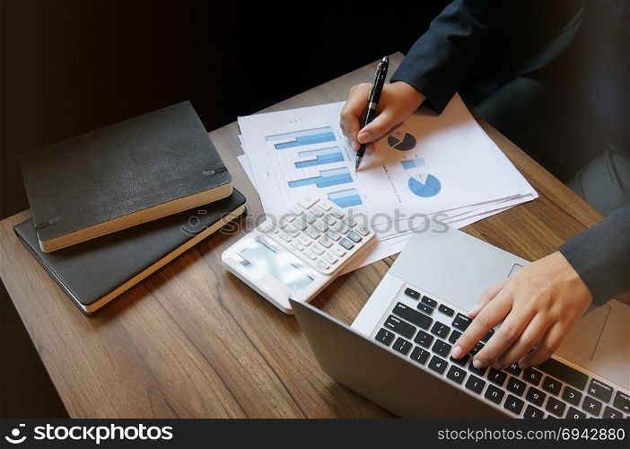 Business accounting women work with calculator and Laptop. Financial technology concept.