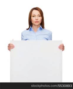 business, advertisement and education concept - friendly young calm businesswoman with white blank board