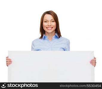 business, advertisement and education concept - friendly young smiling businesswoman with white blank board