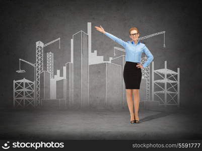 business, advertising and office concept - smiling businesswoman in eyeglasses showing construction site