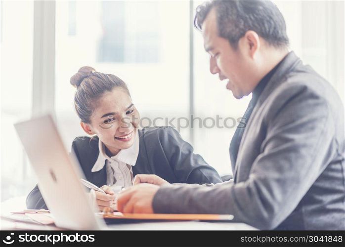 Business adviser analyzing financial figures denoting the progre. Two analysts discussing online data in front of laptop. Two analysts discussing online data in front of laptop