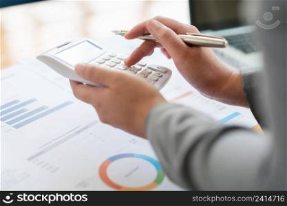 Business analyst concept the accountant calculating to estimate the amount of company’s expense.