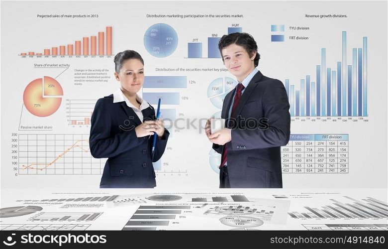 Business analytics. Businessman and businesswoman analyzing data information of market